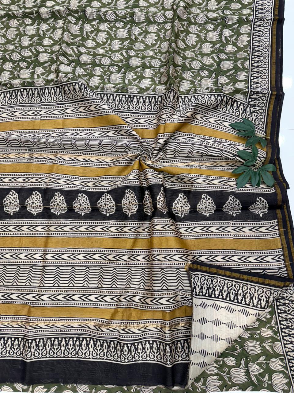 A traditional Bagru hand block printed saree featuring earthy tones and ethnic wooden block motifs on premium silk.