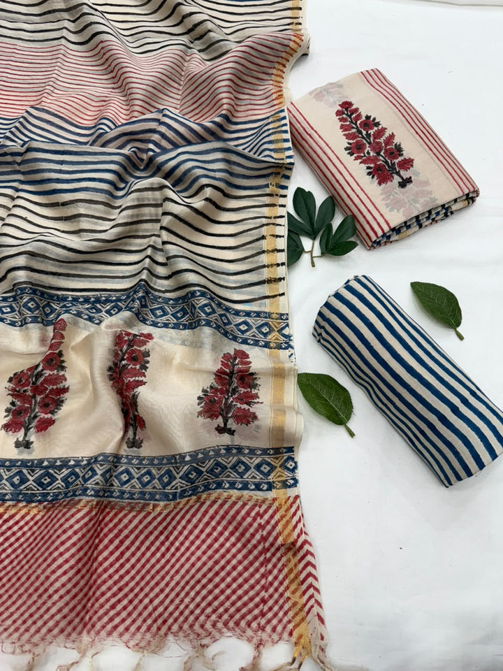 Alt Text:
Handblock printed Chanderi silk fabric with red and blue striped border, floral motifs, and indigo block-printed accents