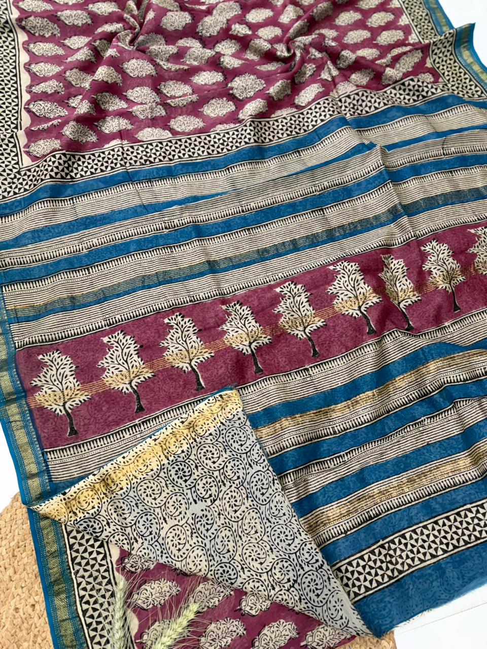 Handblock printed Maheshwari silk saree featuring deep wine and indigo blue colors with intricate traditional tree and geometric patterns.