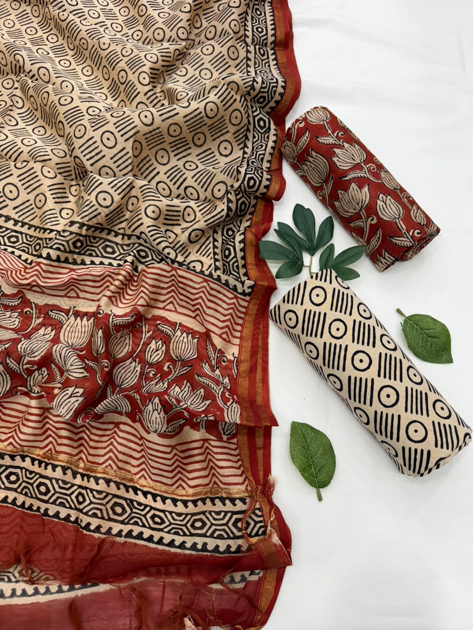 Handcrafted Kalamkari hand-block printed Chanderi silk suit set featuring a beige patterned top, matching dupatta, and solid fabric rolls displayed against a clean background.