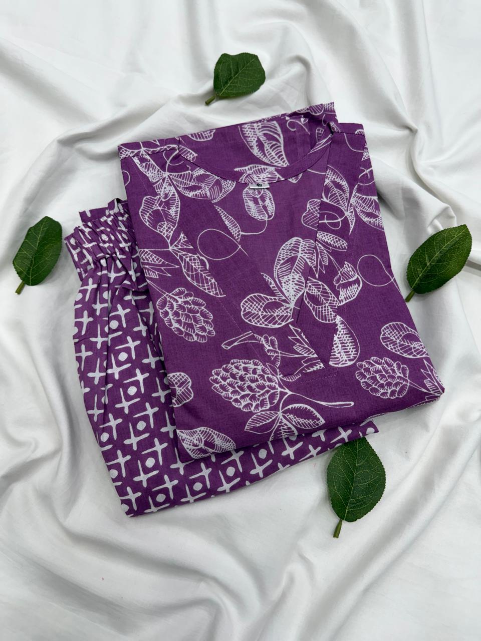 Natural indigo blue dye se bana Bagru hand block print floral cotton kurta, jo white background par fold karke display kiya gaya hai.