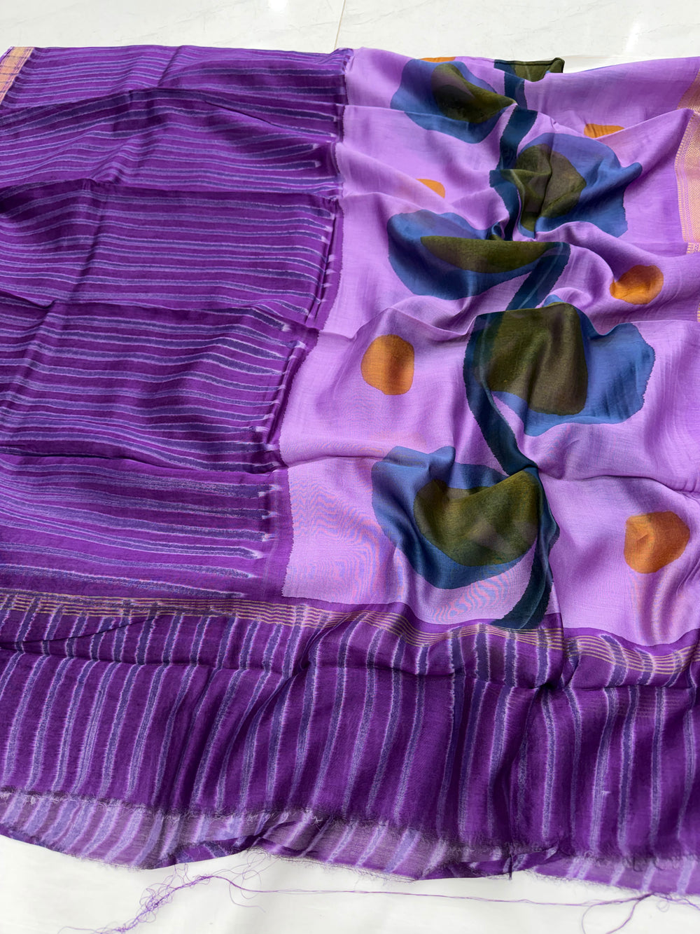Purple Maheshwari silk dupatta featuring abstract blue, green, and orange floral prints and a rich gold zari border