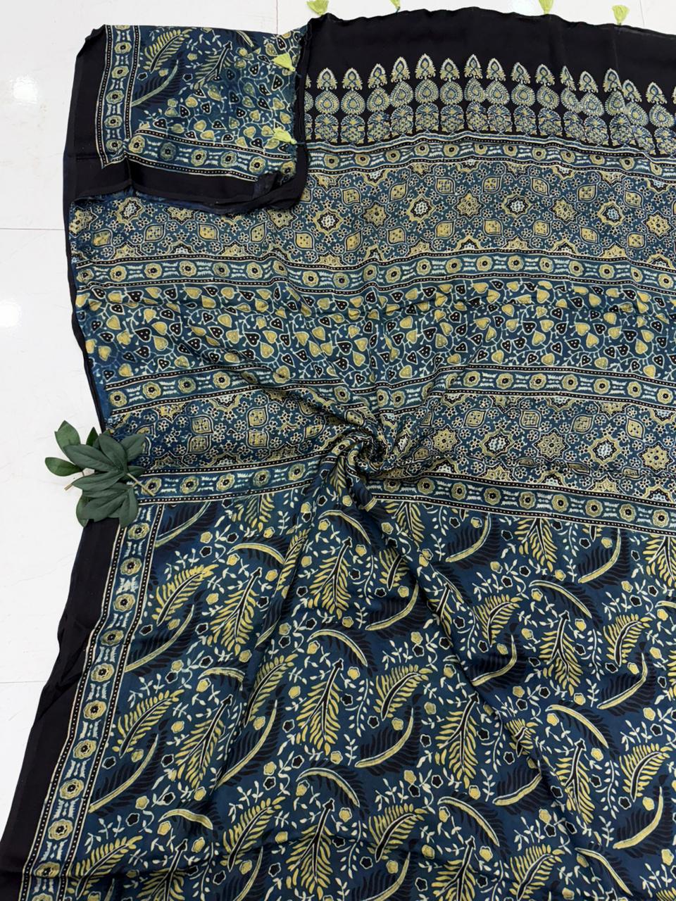 Authentic hand-block printed Ajrakh modal silk saree in deep navy blue and yellow floral motifs by Bagru Hastkala.
