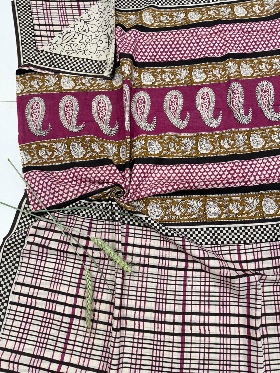 Collection of patterned fabric strips with paisley and checkered designs.
