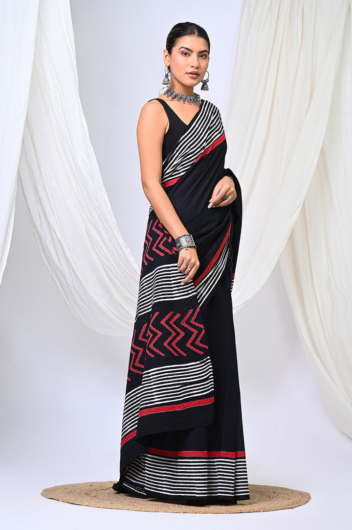 Authentic Bagru handblock printed soft mulmul cotton saree highlighting the black, white, and red geometric patterned pallu layout.