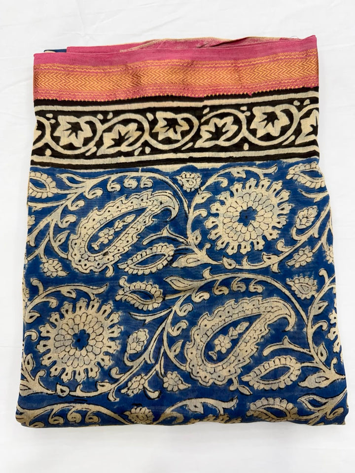 Close-up of the unstitched Maheshwari silk kurta fabric in Bagru blue, featuring traditional hand block printed floral or geometric motifs.