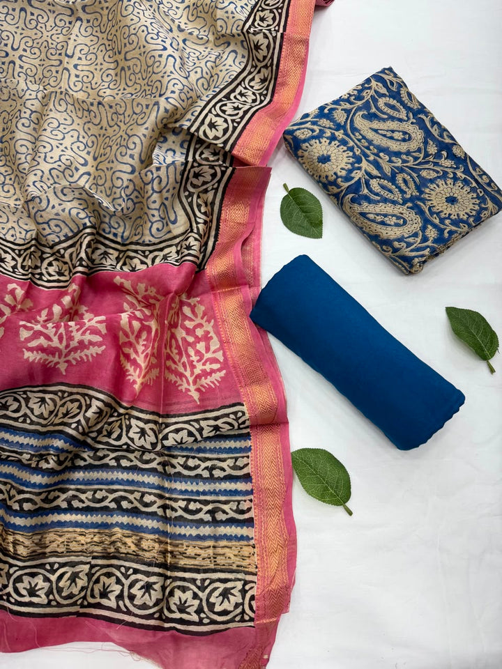 Full flat lay view of the Bagru Blue Maheshwari Silk Suit Set, showing the indigo blue block-printed fabric, matching patterned dupatta with a golden border, and solid blue bottom fabric.