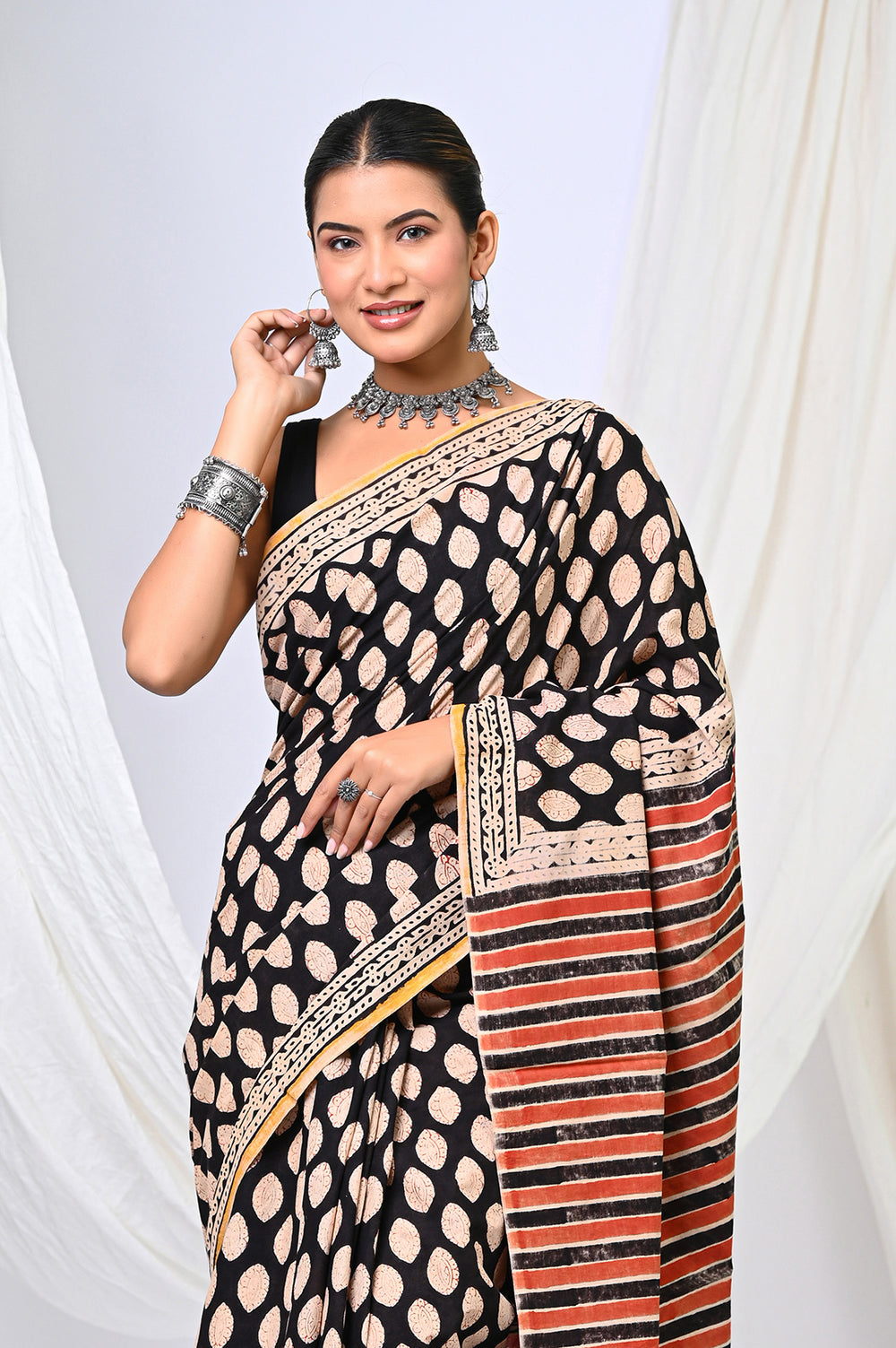 Handcrafted Bagru hand block printed soft mulmul cotton saree with natural black and rust buti designs.