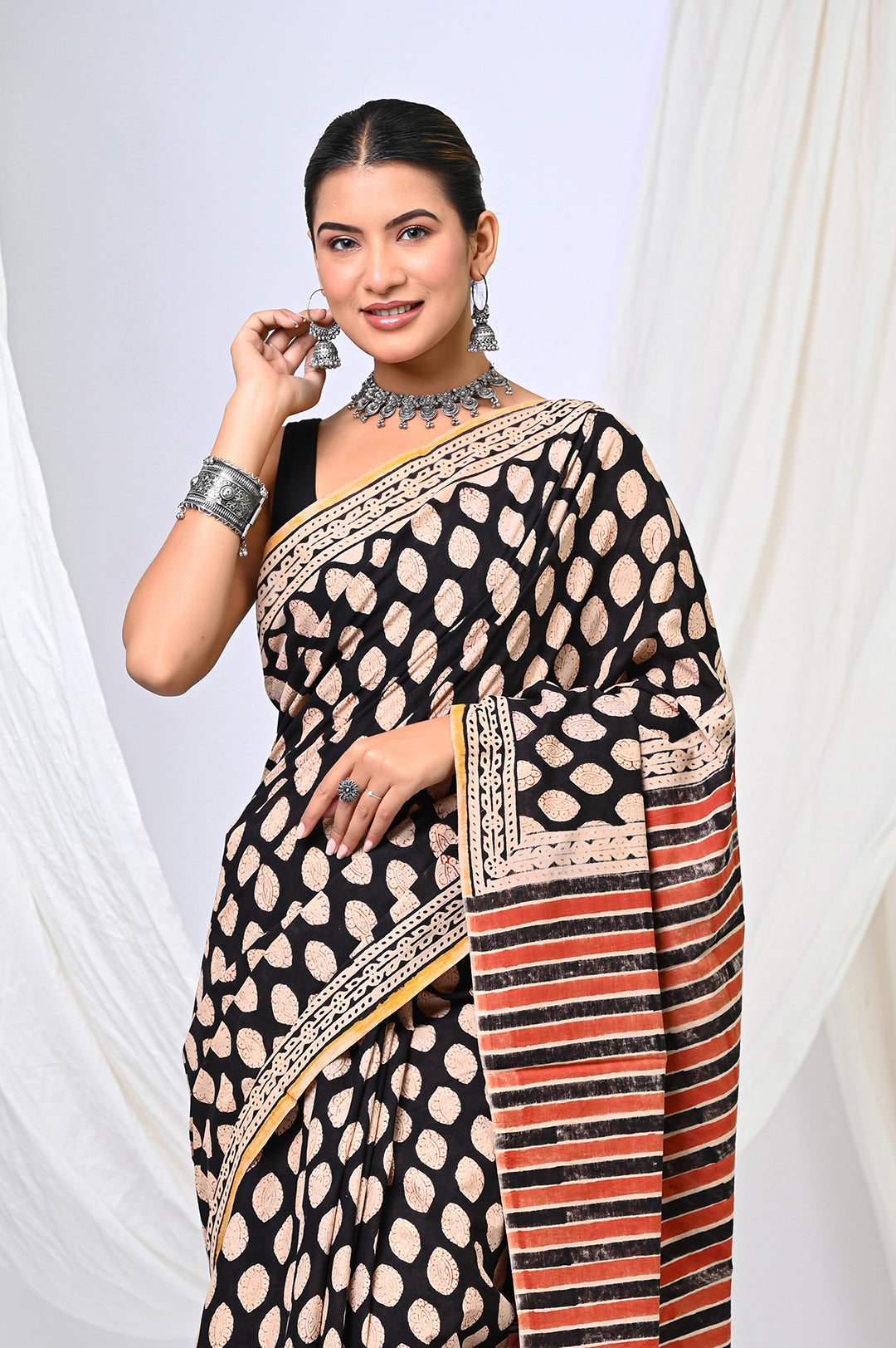 Handcrafted Bagru hand block printed soft mulmul cotton saree with natural black and rust buti designs.