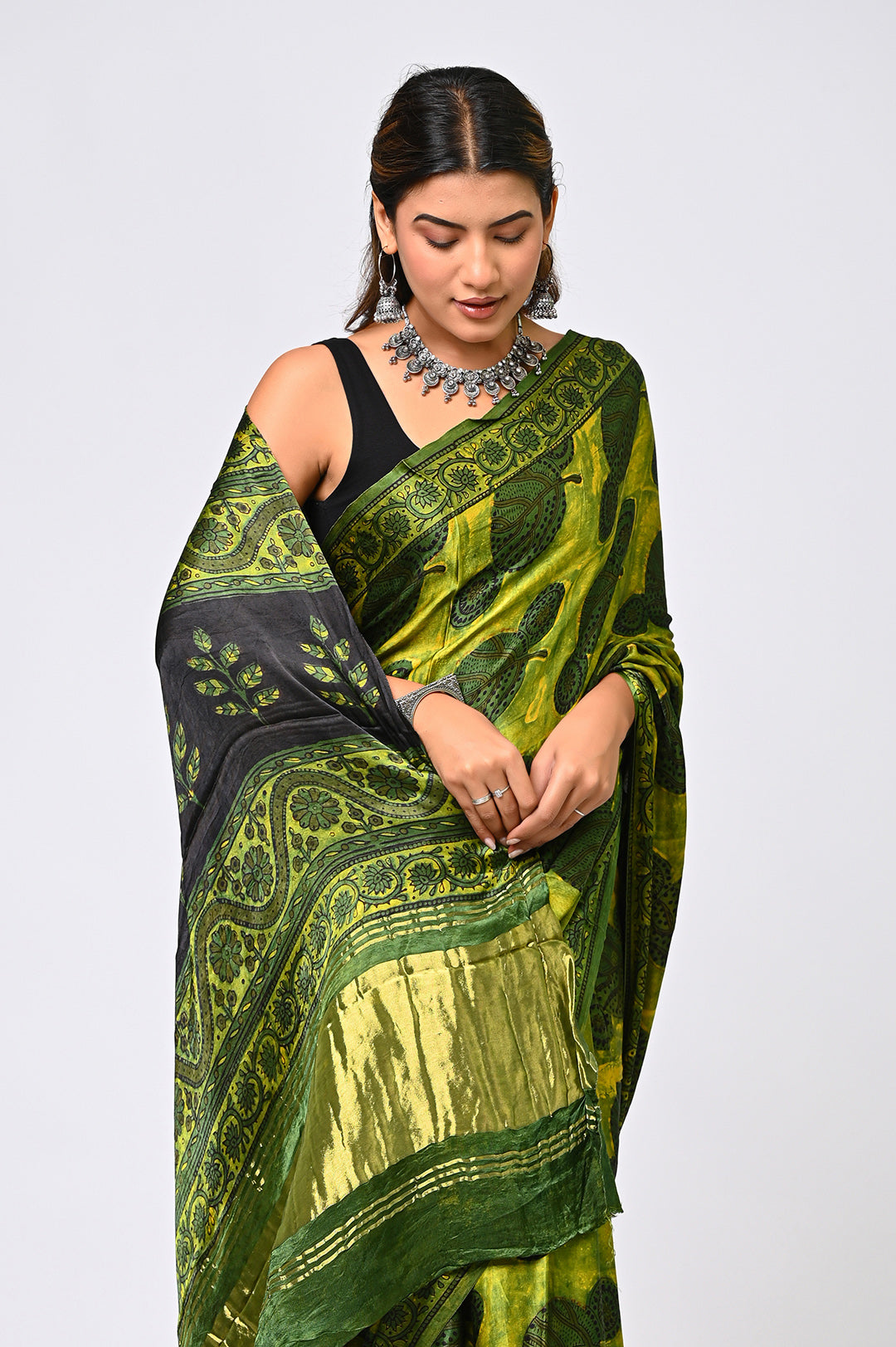 Authentic Rajasthani hand block printed geometric Ajrakh saree in earthy green and black, crafted on premium soft Modal Silk by Bagru Hastkala.