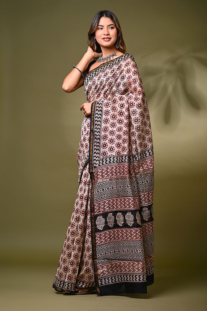 An eco-friendly plant-based dyed natural cream Chanderi silk saree showcasing its sheer texture, luxurious fluid drape, and heritage Bagru block printing.