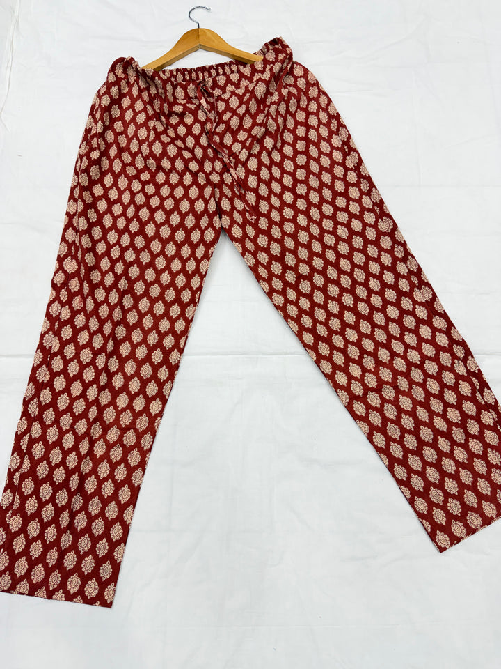 Traditional Rajasthani Bagru block print waala rust aur gud color ka pure cotton bottom wear ya trouser kapda.