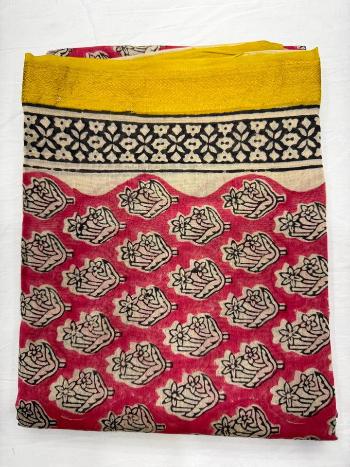 Close-up of the unstitched cream and peach Maheshwari silk kurta fabric, featuring traditional all-over Bagru hand block printed floral buti motifs in rich red and black outlines.