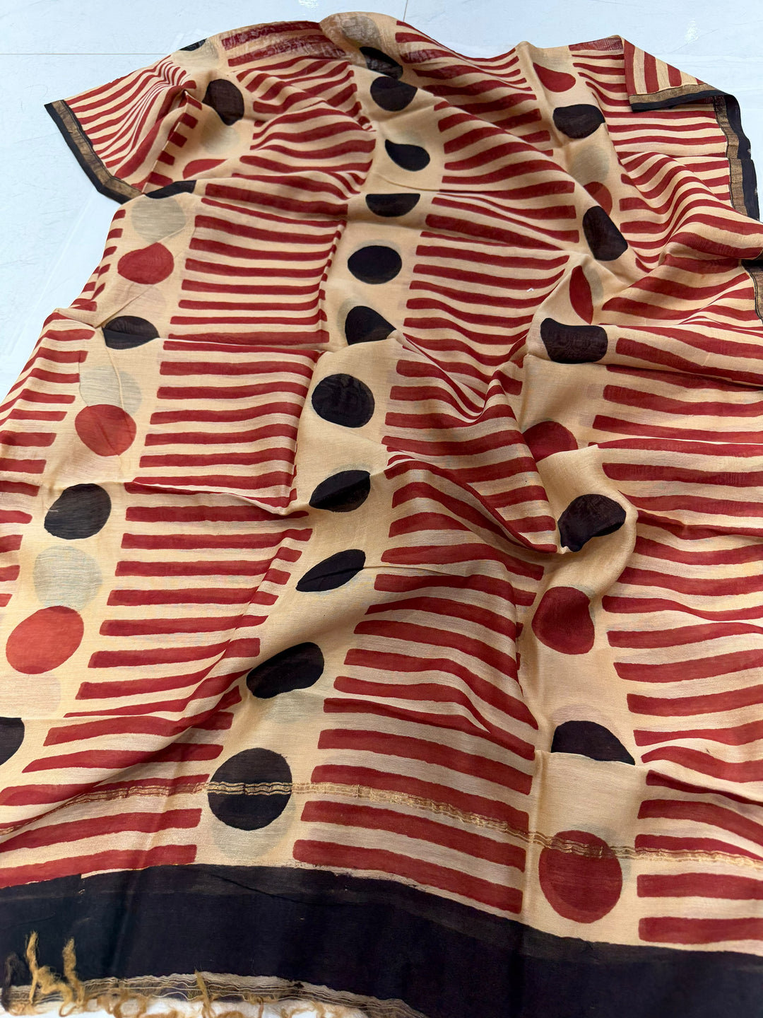 Alt Text:
Handblock printed beige and red striped Chanderi silk dupatta with traditional border details and circular motif accents
