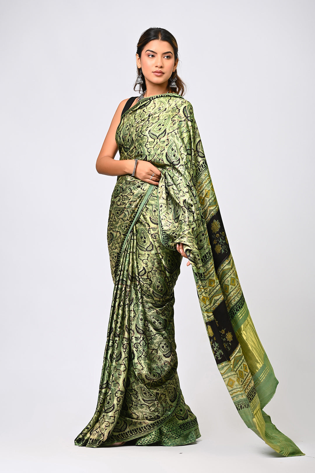 Traditional natural green and black hand block print Ajrakh Modal Silk saree with intricate geometric patterns by Bagru Hastkala Printers.