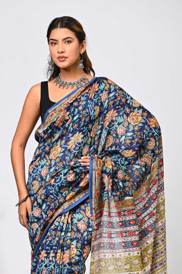 Full-length view of a premium pure Chanderi silk saree in serene blue, handcrafted with traditional Sanganeri hand block printing and detailed Kalamkari floral motifs.