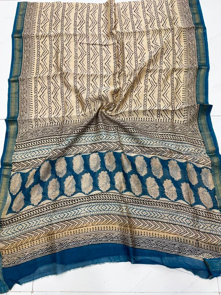 Detailed view of the beige and blue handloom Maheshwari silk dupatta, highlighting the intricate geometric borders, traditional block prints, and a premium handloom woven golden Zari border.