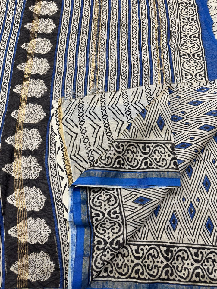 Blue and white Chanderi Silk saree with traditional Bagru hand block prints and a gold border.