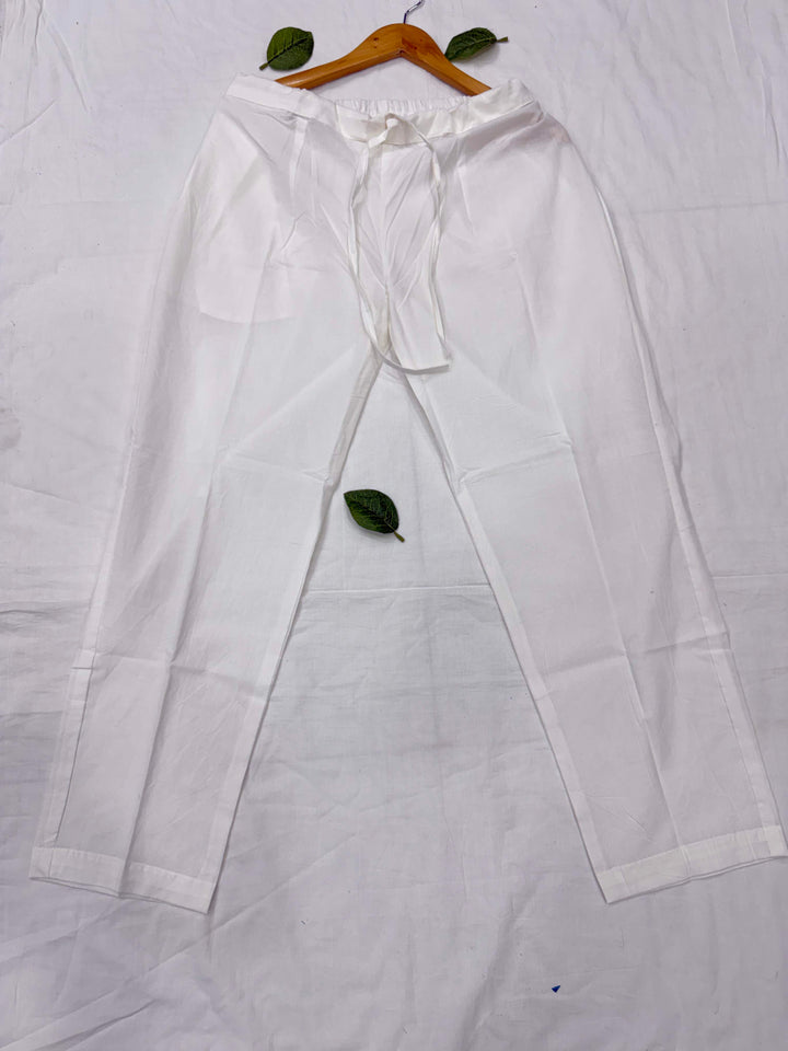 Tailored classic white cotton pants featuring a comfortable regular fit, designed for styling with ethnic tops and tunics.