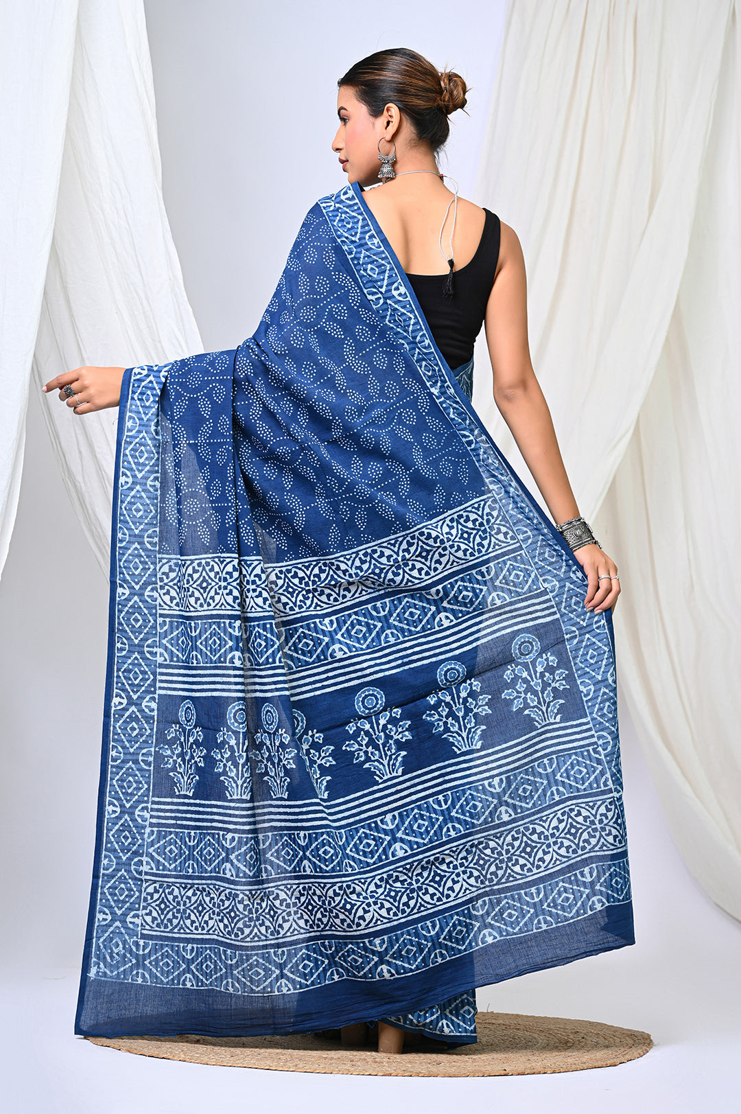 Handcrafted natural indigo dye soft mulmul cotton saree showcasing traditional Bagru Dabu hand block prints and a geometric dot motif layout.