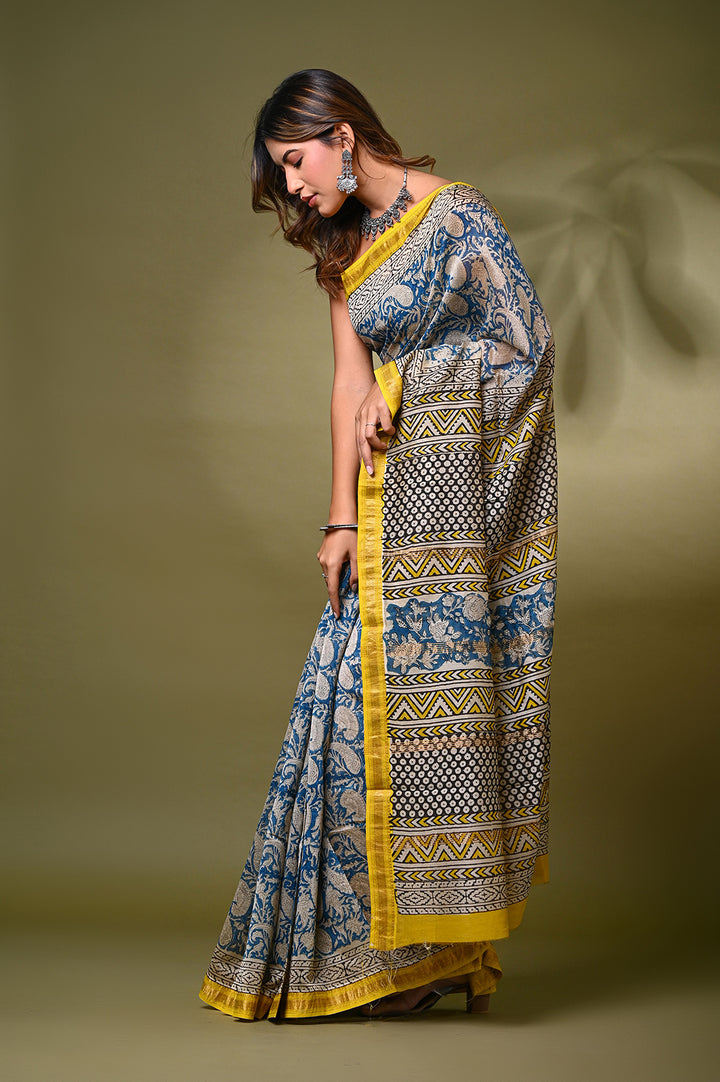 "Blue and cream Bagru print Maheshwari silk saree with yellow border by Bagru Hastkala Printers."
