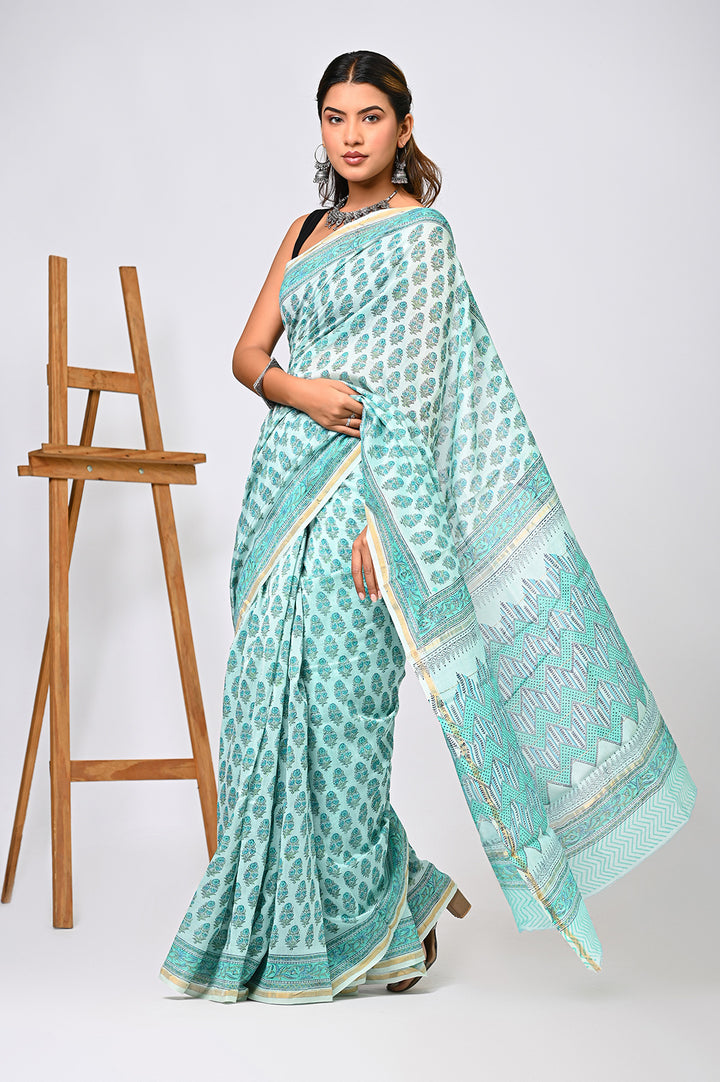 An authentic handblock printed mint green Chanderi silk saree with small floral details, showing a feather-light and lustrous texture against a clean backdrop.