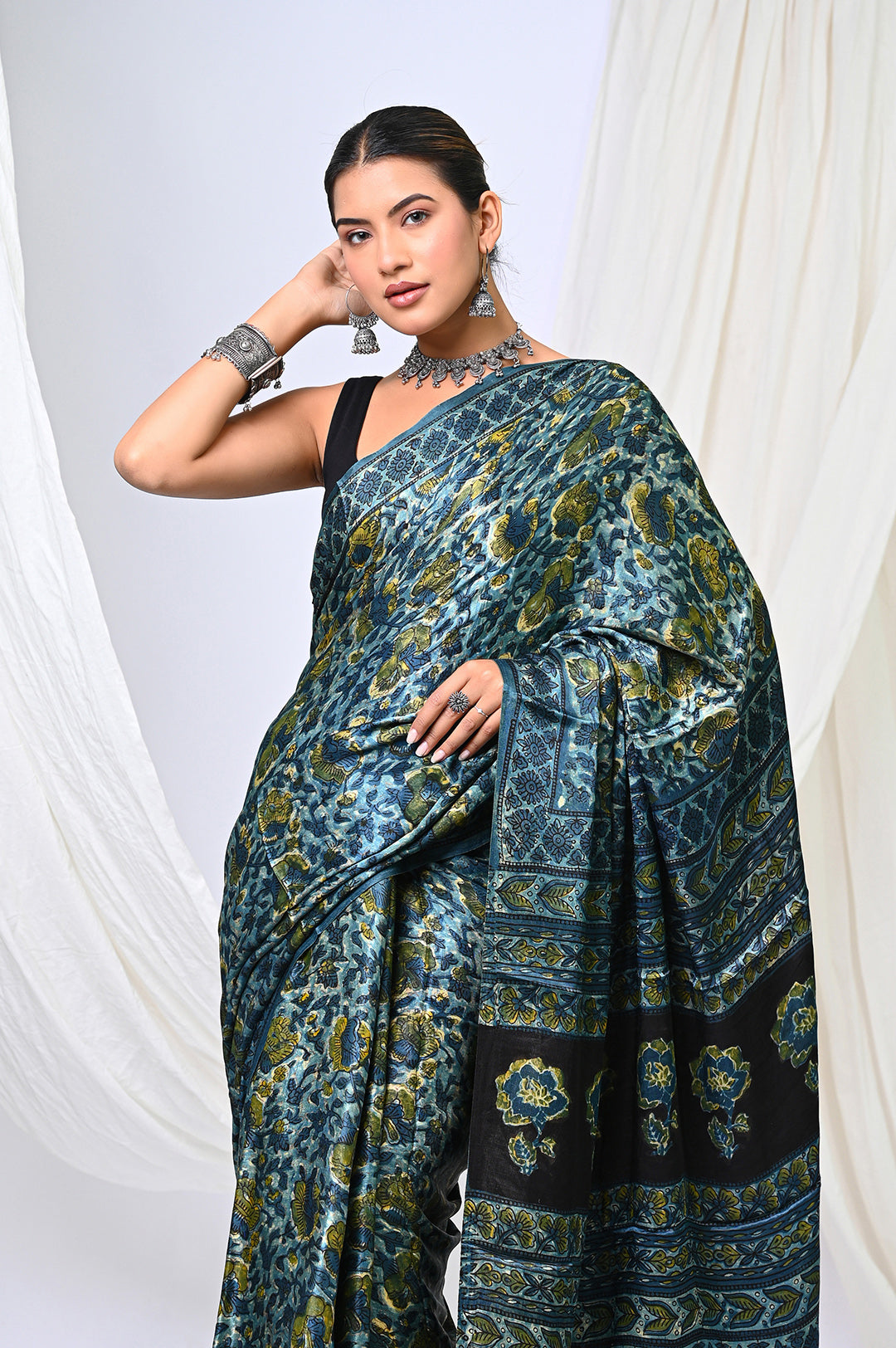 Premium natural dyed indigo and green Ajrakh Modal Silk saree with a lustrous sheen, perfect for luxury festive and wedding wear.