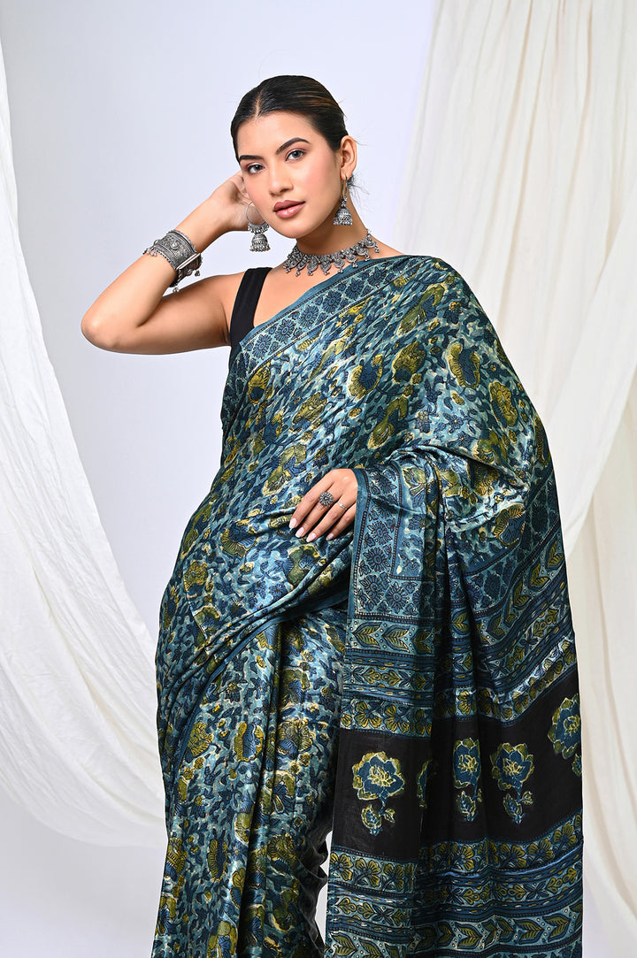 Premium natural dyed indigo and green Ajrakh Modal Silk saree with a lustrous sheen, perfect for luxury festive and wedding wear.