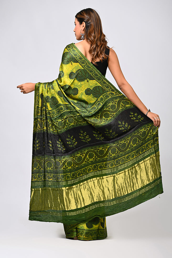 Premium natural green Vanaspati print Modal Silk saree with a lustrous finish, perfect for luxury festive and wedding occasion wear.