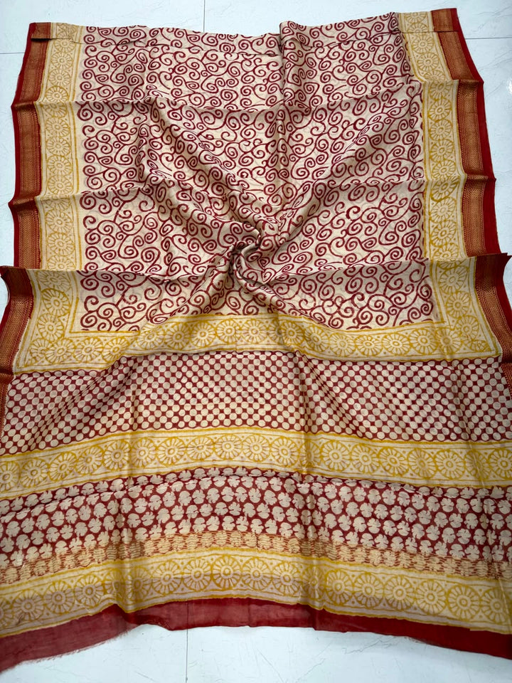 Detailed view of the cream and maroon handloom Maheshwari silk dupatta, showcasing fine geometric blocks, traditional patterns, and a premium handloom woven golden Zari border.