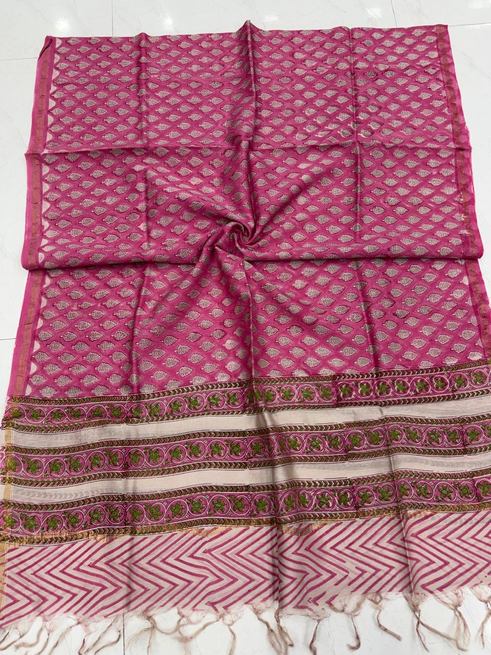 Pink pure Chanderi silk dupatta featuring floral hand block prints, patterned border, and tassels.