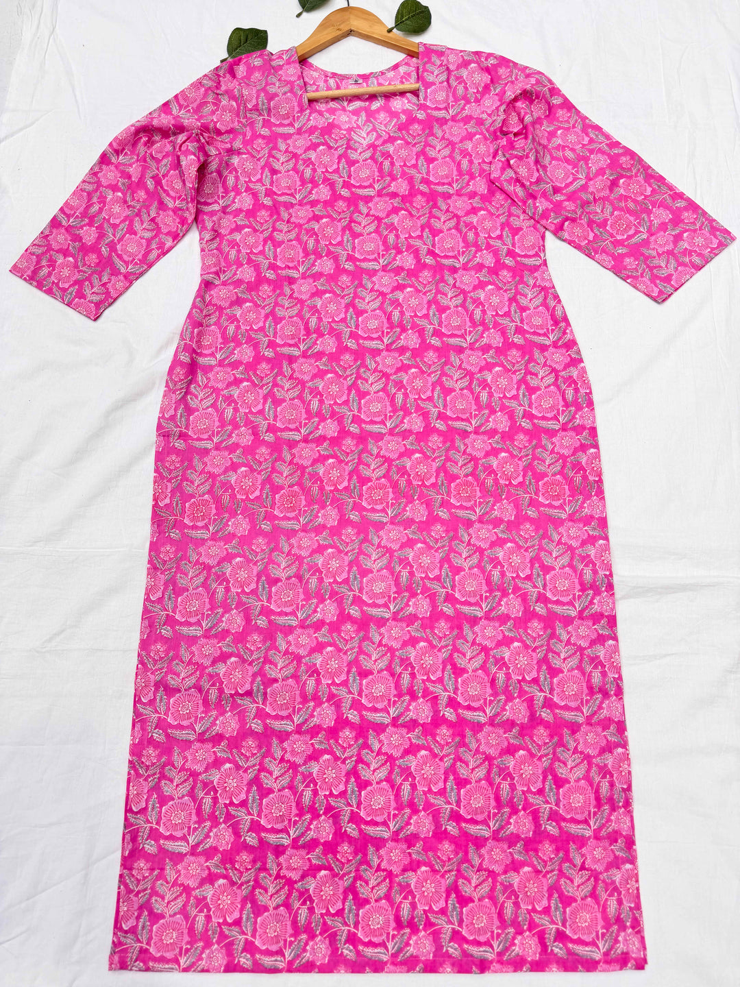 Close-up shot of the pink floral print cotton kurta, highlighting the elegant sweetheart neckline and detailed screen print design.