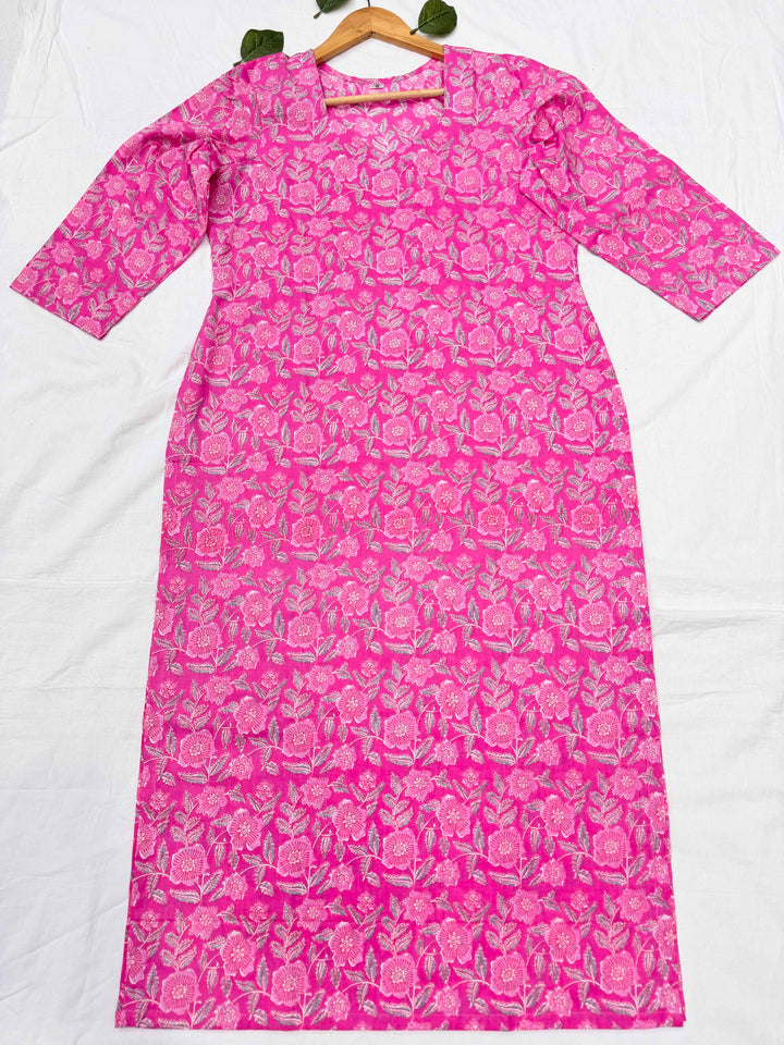 Close-up shot of the pink floral print cotton kurta, highlighting the elegant sweetheart neckline and detailed screen print design.