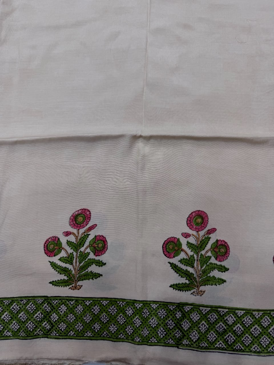 Premium quality solid beige unstitched Santoon silk bottom fabric, neatly rolled for the palm tree print Maheshwari silk suit set.
