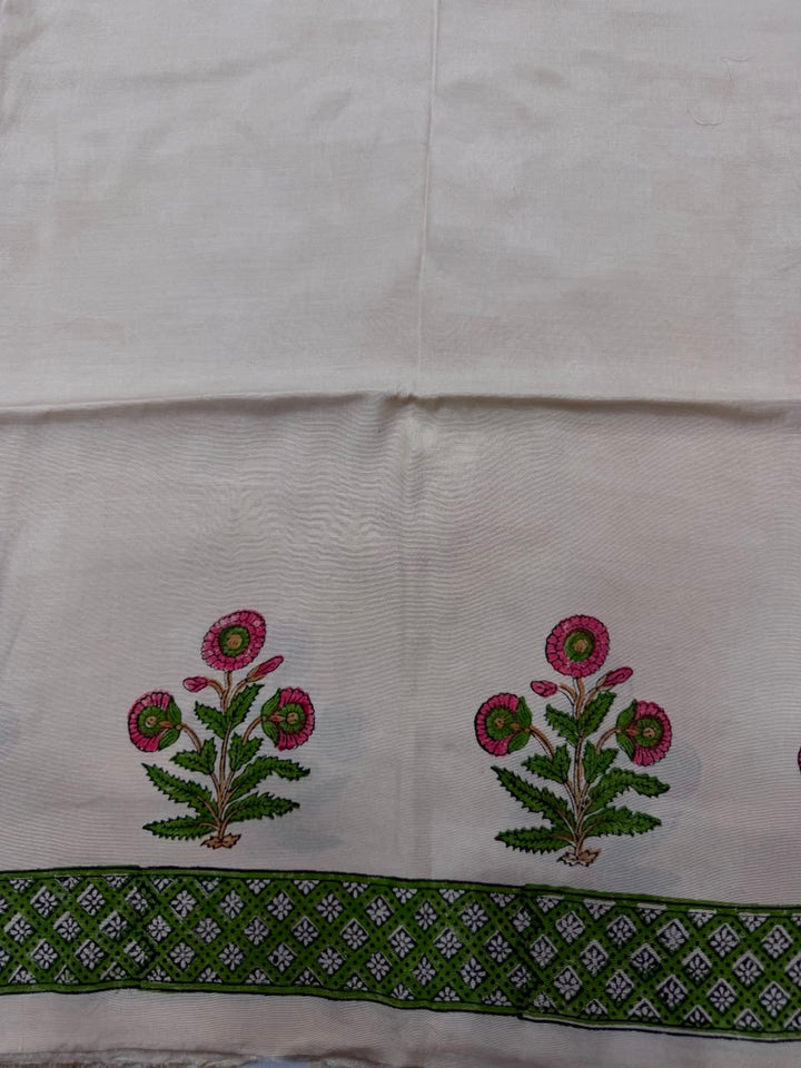 Premium quality solid beige unstitched Santoon silk bottom fabric, neatly rolled for the palm tree print Maheshwari silk suit set.
