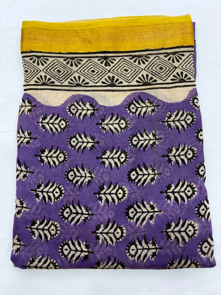 Close-up of the unstitched royal purple Maheshwari silk kurta fabric, highlighting the traditional, delicate all-over Bagru buti floral motifs hand-printed by master artisans.