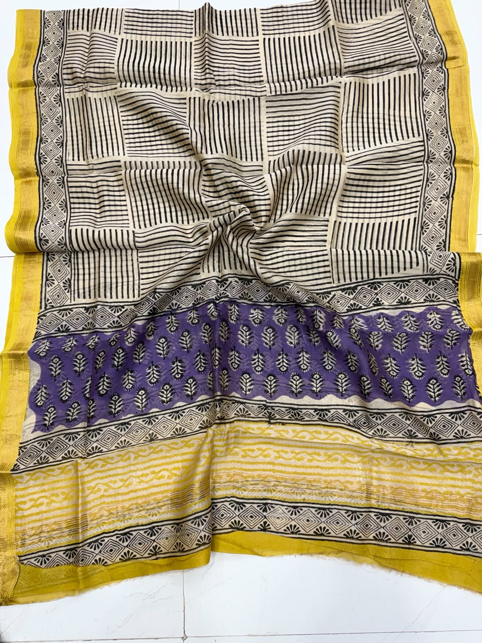 Detailed view of the regal purple handloom Maheshwari silk dupatta, featuring intricate Bagru block prints, elegant patterns, and a rich golden woven Zari border.