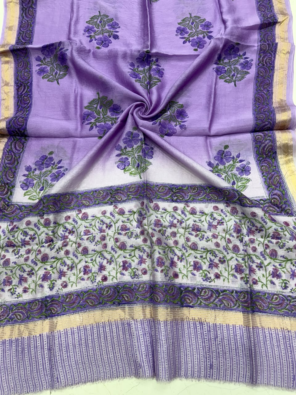 Detailed view of the luxurious purple handloom Maheshwari silk dupatta, highlighting the intricate Sanganeri traditional block prints and the rich handloom woven golden Zari border.