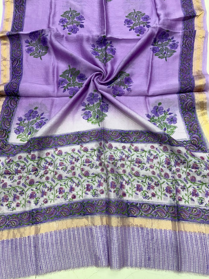 Detailed view of the luxurious purple handloom Maheshwari silk dupatta, highlighting the intricate Sanganeri traditional block prints and the rich handloom woven golden Zari border.