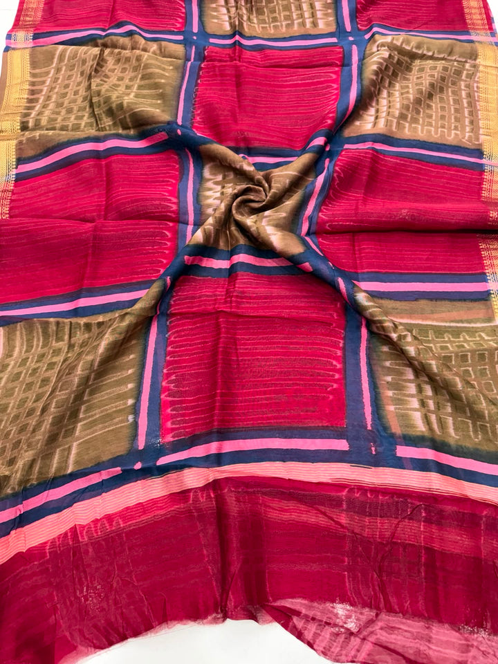 Detailed view of the red handloom Maheshwari silk dupatta, highlighting the unique batik wax-resist textures, patterns, and the elegant handloom woven golden Zari border.